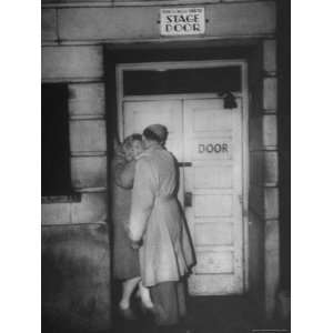  Couple Embracing Outside the Stage Door of Prince of Wales 