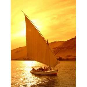  A Felucca Cruises on the Nile River at Sunset Stretched 