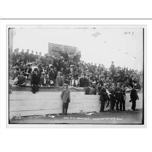   Crowd, including Mrs. W.K. Vanderbilt, at auto race, in stands