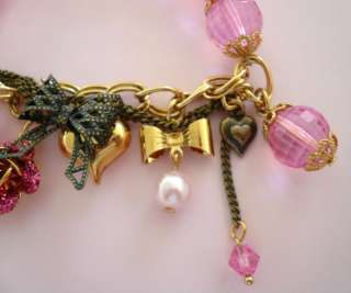 Betsey Johnson Multi Charms Bracelet features pink beads, bear with 