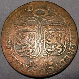   Spain, 1586 Copper Penny. Two arms Flanders and Brabant ribbon  