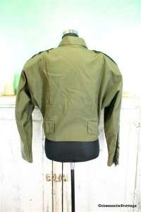 Vintage army green light cropped jacket. Black fringe on the arms 