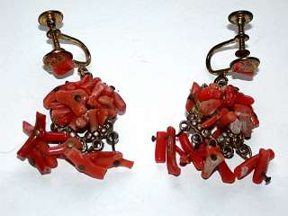 This auction is for an Antique Hand Made Orange/Red Coral Screw Back 