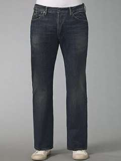 Button fly Low rise belted waist Straight leg Five pocket jean with 